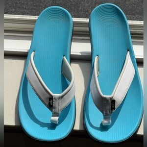NIKE Women's Bella Kai Aqua Blue and White Flip Flop Sandals